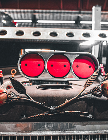 Bright red air intake scoop on a custom engine build inside the Fry's Auto Care shop